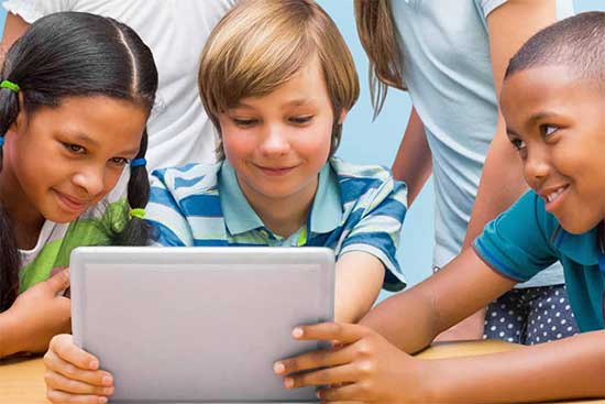 Three students collaborate on a tablet computer.