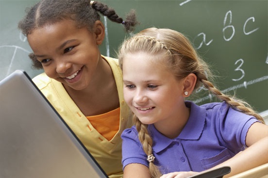 Teacher displays TIM Observation Tool on her tablet computer.